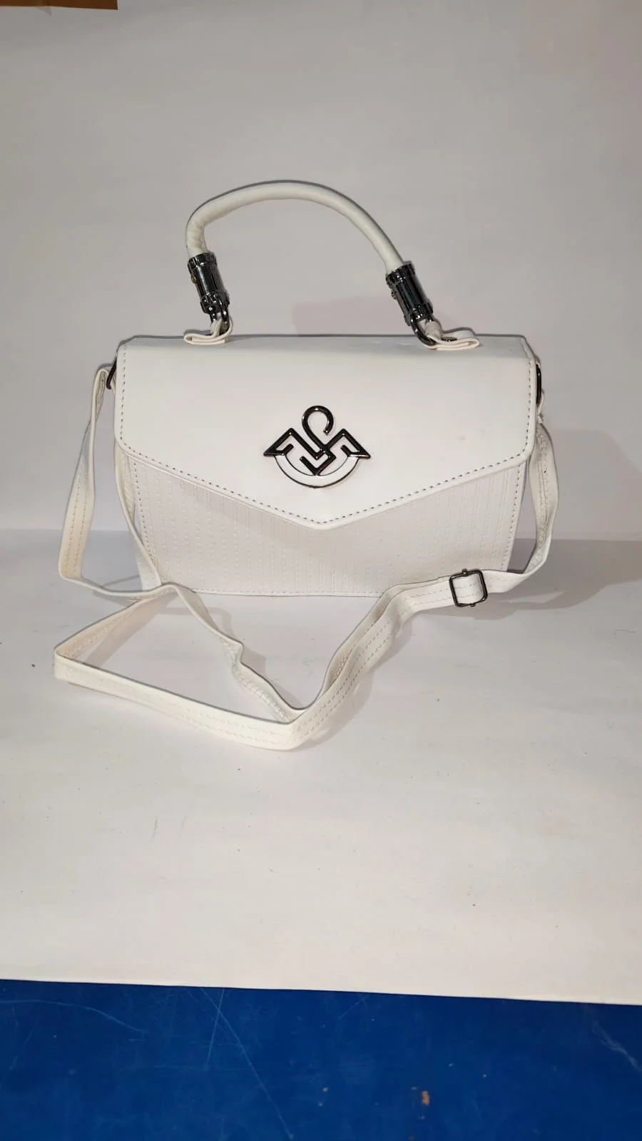 Elegant White Textured Vegan Leather Top-Handle Flap Bag with Detachable Crossbody Strap and Geometric Metallic Hardware image 1