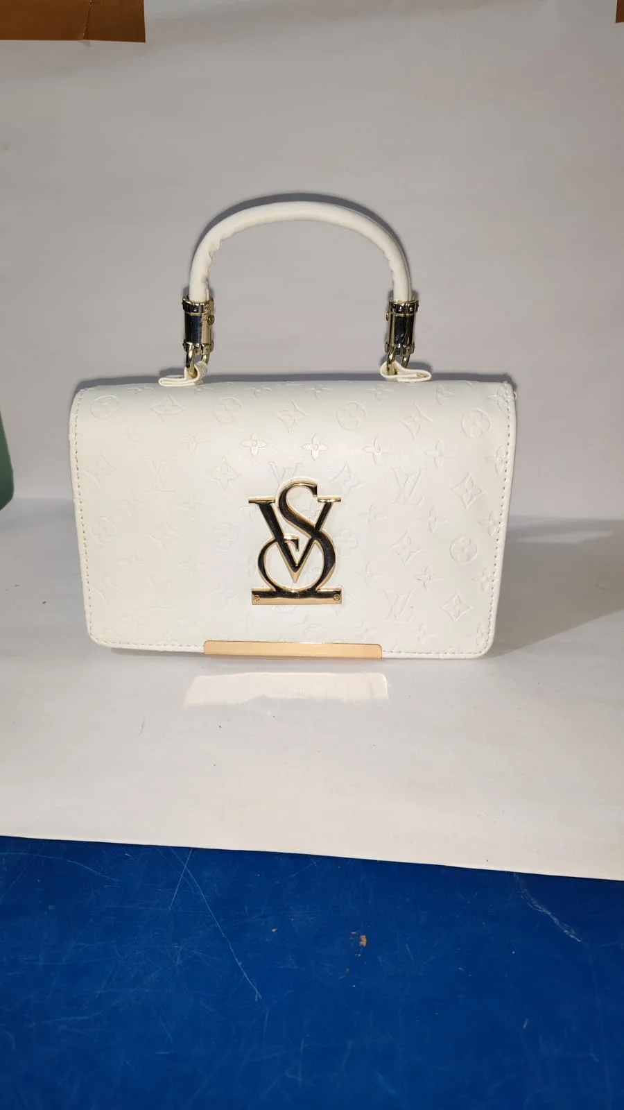 The Monogrammed Opulence: Pearl White Embossed Top-Handle Flap Bag with Metallic VS Interlock and Gold-Tone Hardware. image 1