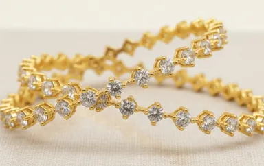 Diamond Cut Stone Studded Bangles by Bhabyam Jewellery. Premium craftsmanship, traditional design, and perfect for festive and wedding wear. Diamond Cut Stone  2.8 thumbnail 0