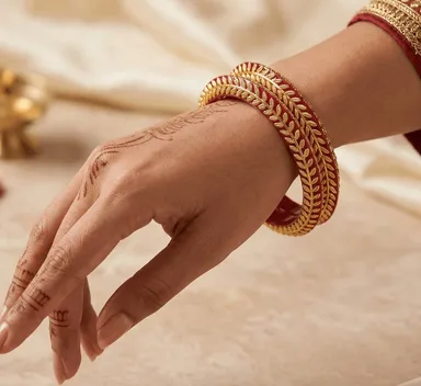 Red Pola Bangle Pair with elegant golden leaf border. Perfect for weddings, festivals, pooja, and ethnic wear. Shop online at Bhabyam Jeweller Red 2.8 thumbnail 1
