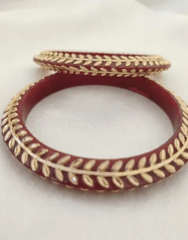 Red Pola Bangle Pair with elegant golden leaf border. Perfect for weddings, festivals, pooja, and ethnic wear. Shop online at Bhabyam Jeweller Red 2.8 thumbnail 2