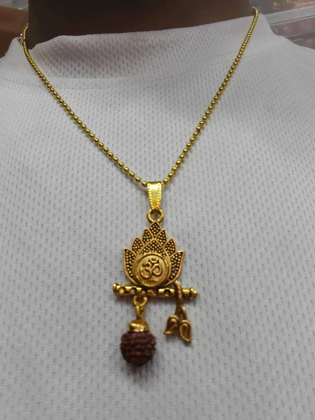 Premium Gold Plated Lord Krishna Flute (Bansuri) Pendant Necklace with Om Lotus Design & Natural Rudraksha Bead for Men & Women | Hindu Spiritual Religious Chain | Devotional Jewelry for Daily Wear & Gifting Gold Plated Lord Krishna Flute Free image 2